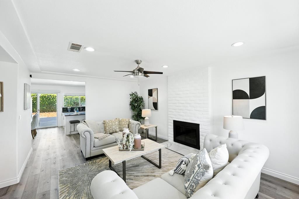 Fireplace, Interior, Living room, Recessed Lighting, Stone Walls, Wood Texture Flooring
