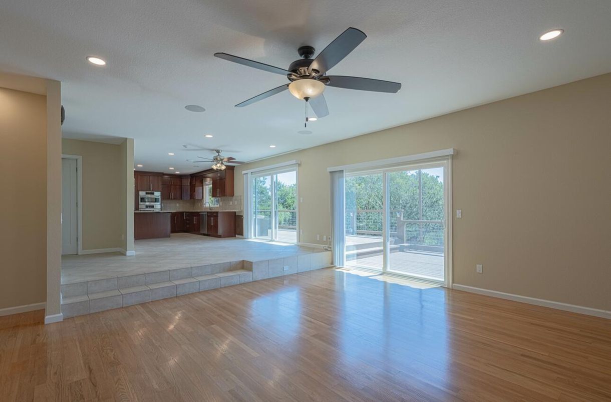 Empty room, Interior, Kitchen, Recessed Lighting, Stainless Steel Appliances, Wood Texture Flooring