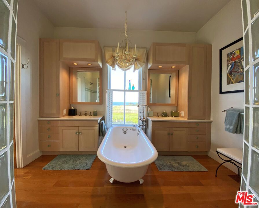 Bathroom, Chandelier, Dual Sink Vanities, Free Standing Baths, Interior, Recessed Lighting, Wood Texture Flooring