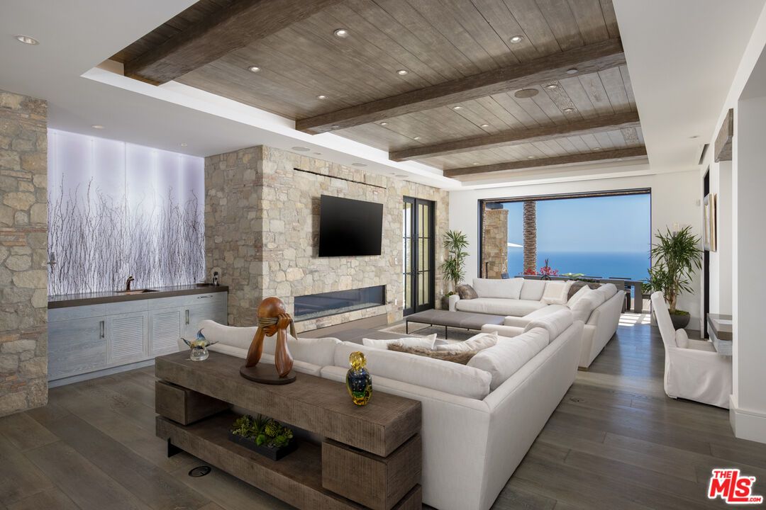 Fireplace, Interior, Living room, Recessed Lighting, Stone Walls, Water, Wooden Beams, Wooden Ceilings, Wood Texture Flooring