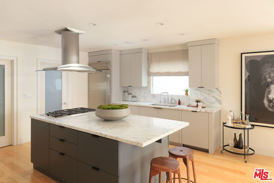 Interior, Kitchen, Marble Walls, Recessed Lighting, Stainless Steel Appliances, Wood Texture Flooring
