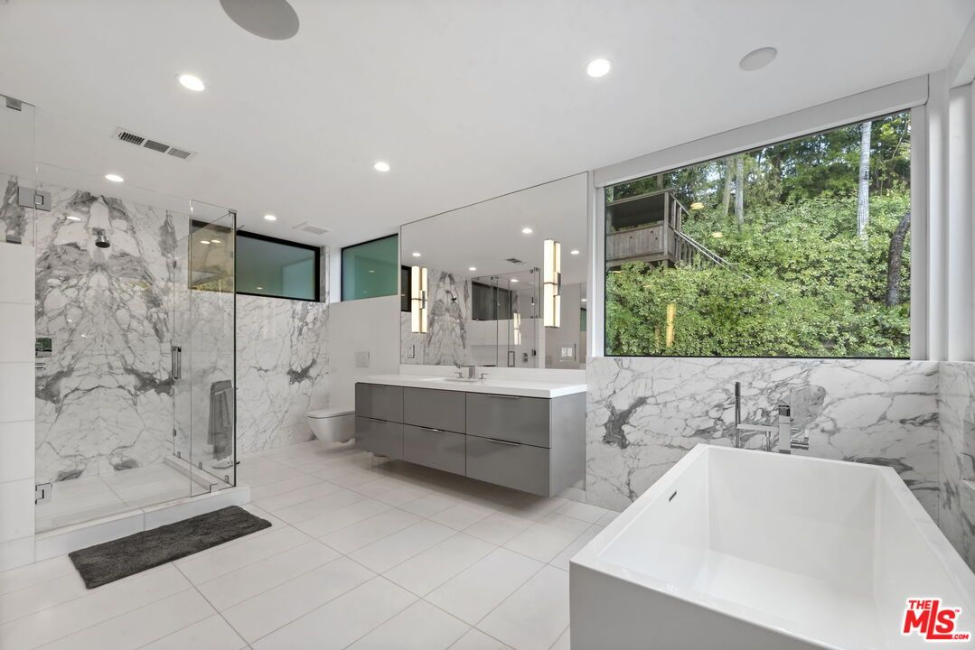 Bathroom, Dual Sink Vanities, Free Standing Baths, Glass Shower, Interior, Marble Walls, Recessed Lighting