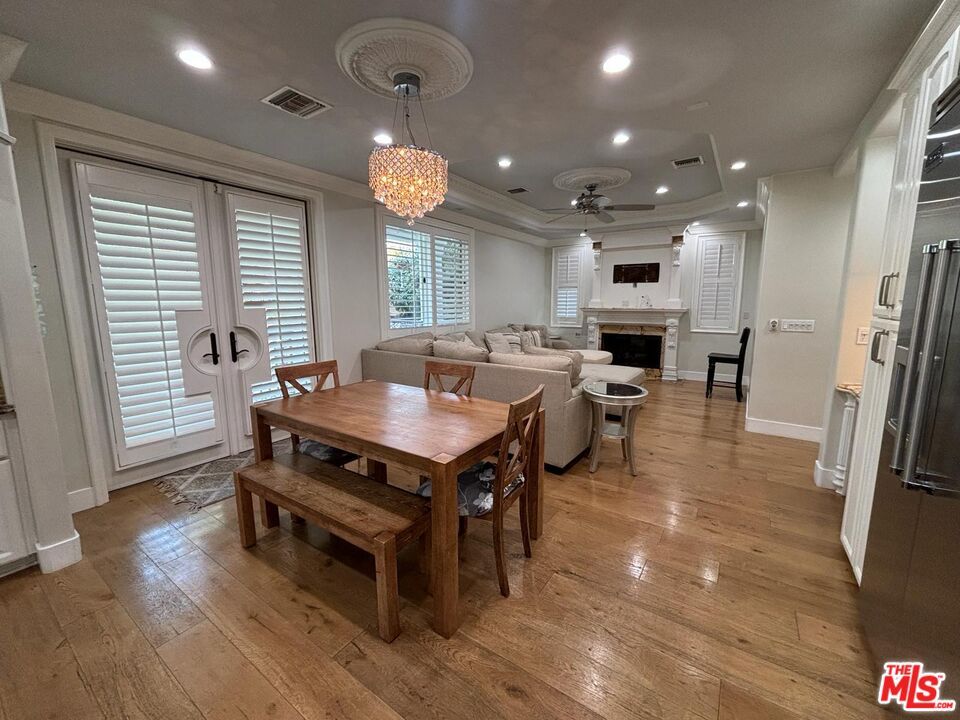 Chandelier, Dining room, Fireplace, Interior, Living room, Recessed Lighting, Wood Texture Flooring