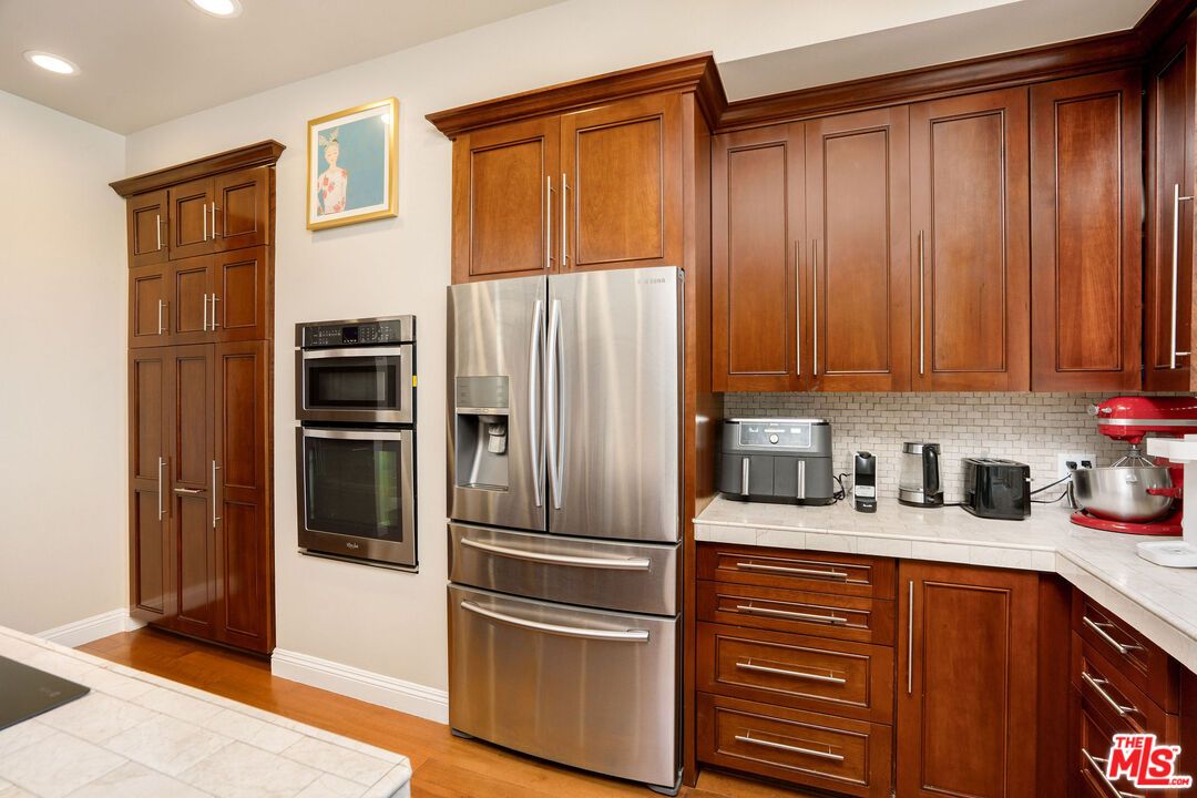 Interior, Kitchen, Recessed Lighting, Stainless Steel Appliances, Tile Countertops, Wood Texture Flooring