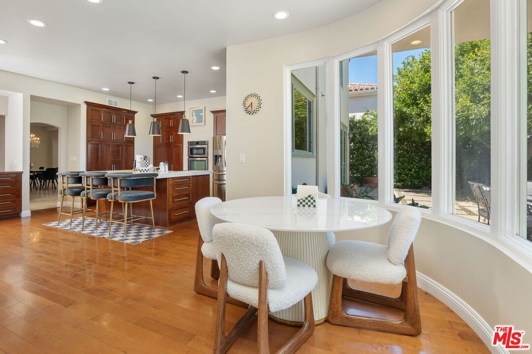 Dining room, Interior, Kitchen, Pendant Lights, Recessed Lighting, Stainless Steel Appliances, Wood Texture Flooring