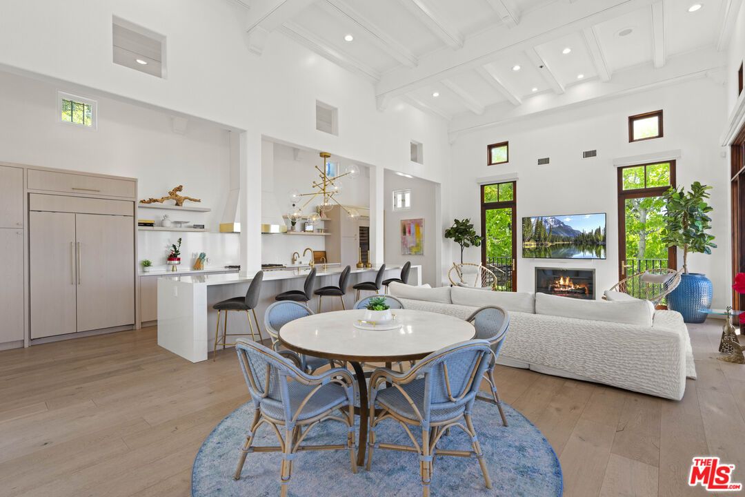 Dining room, Fireplace, Interior, Living room, Pendant Lights, Recessed Lighting, Wood Texture Flooring
