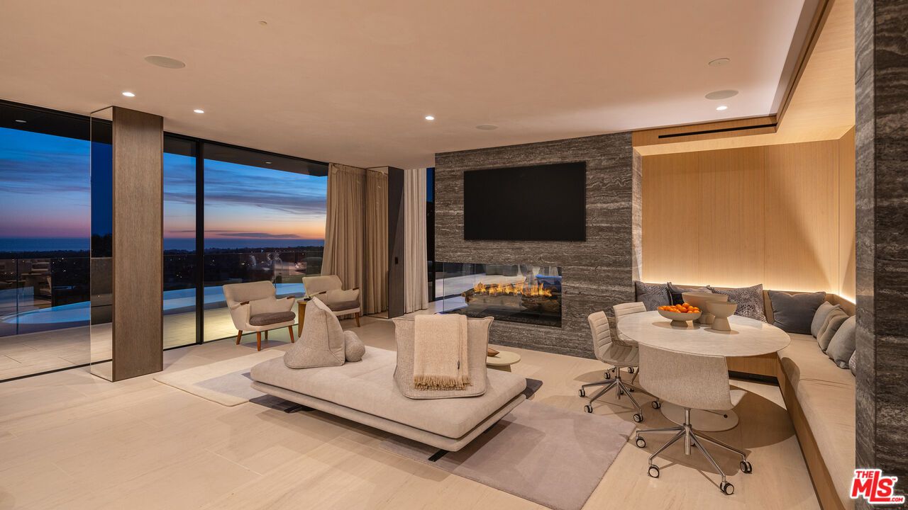 Fireplace, Interior, Living room, Recessed Lighting, Stone Walls, Water, Wood Texture Flooring