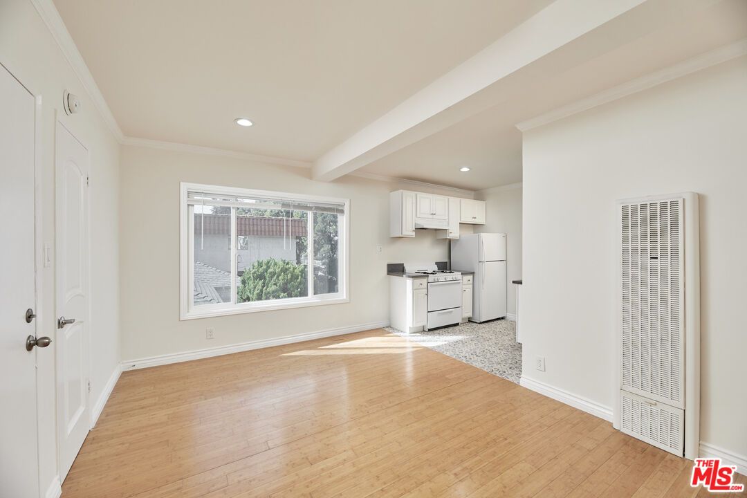 Interior, Kitchen, Recessed Lighting, Washer, Wood Texture Flooring