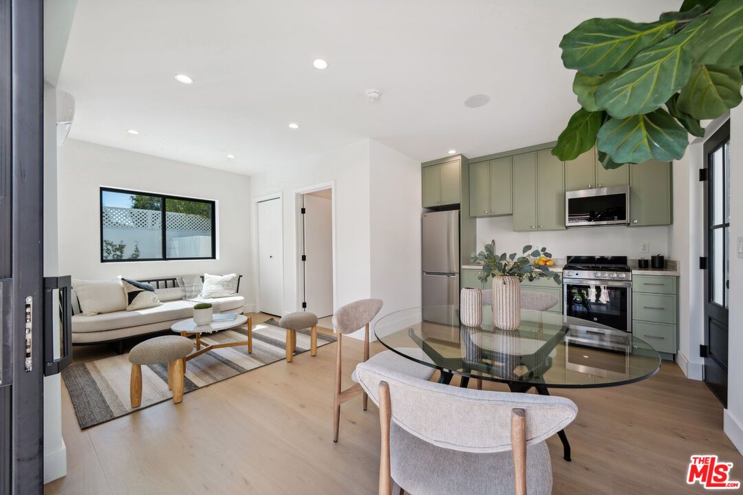 Dining room, Interior, Kitchen, Living room, Recessed Lighting, Stainless Steel Appliances, Wood Texture Flooring