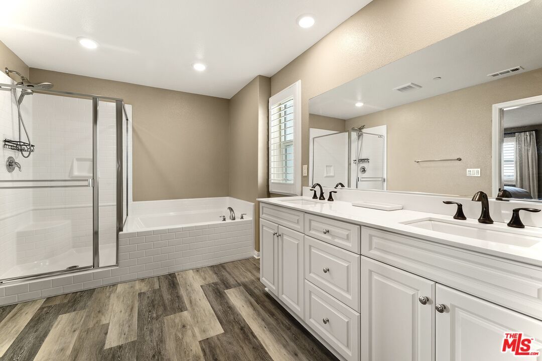 Bathroom, Dual Sink Vanities, Glass Shower, Interior, Recessed Lighting, Wood Texture Flooring