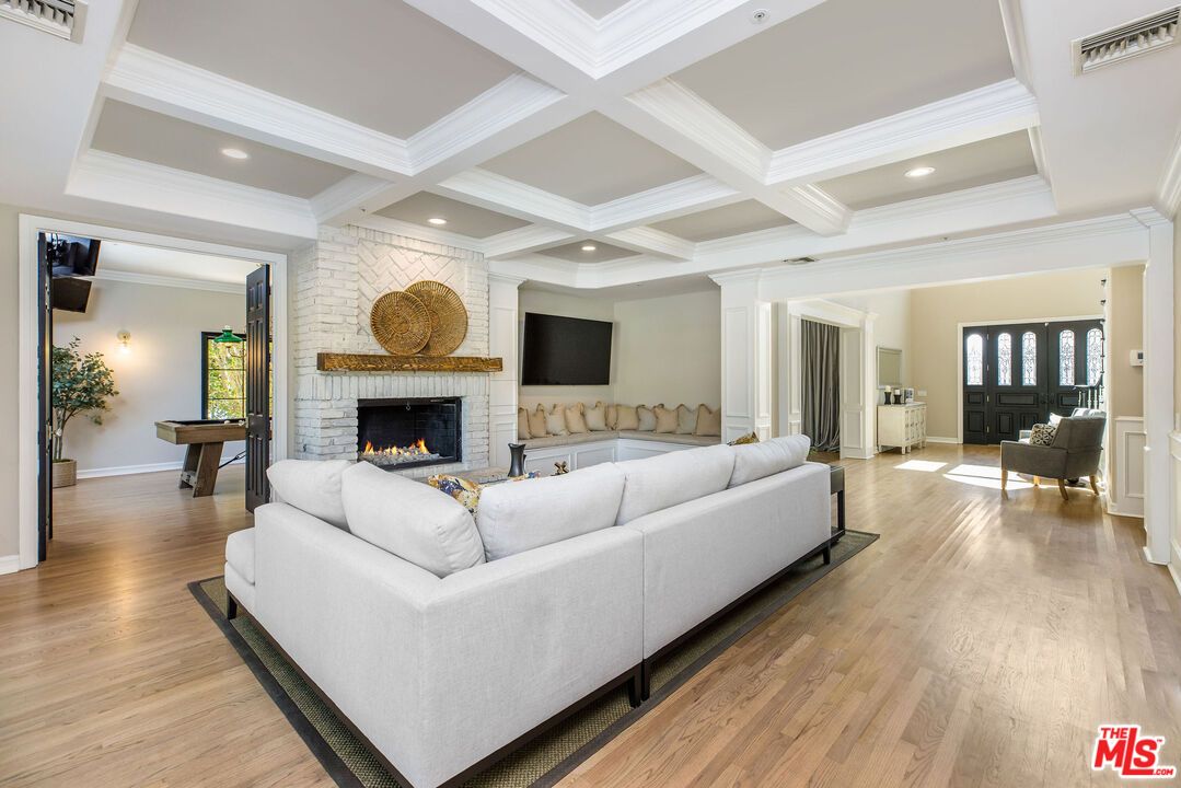 Billiard Table, Fireplace, Game Room, Interior, Living room, Recessed Lighting, Stone Walls, Wood Texture Flooring