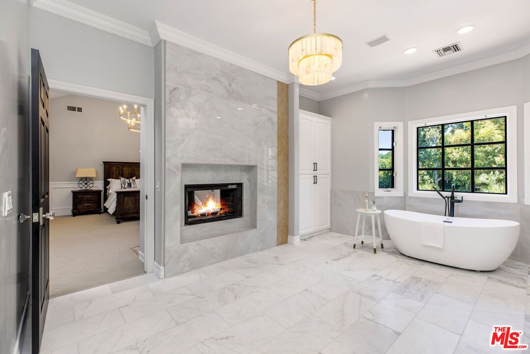 Bathroom, Chandelier, Fireplace, Free Standing Baths, Interior, Marble, Marble Walls, Pendant Lights, Recessed Lighting