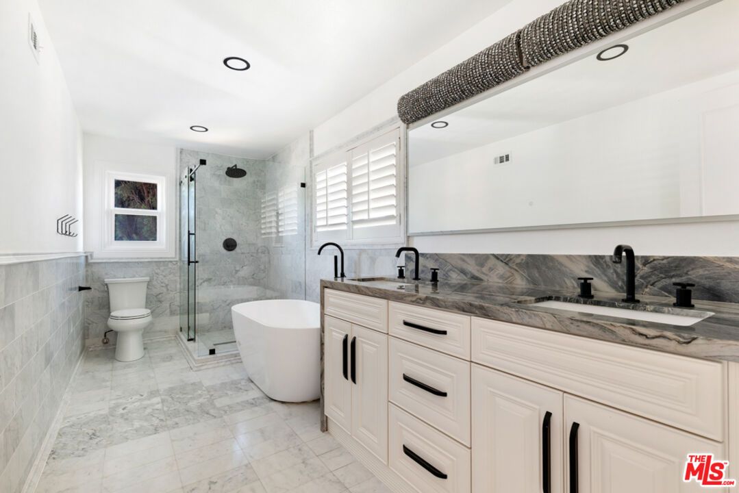 Bathroom, Dual Sink Vanities, Free Standing Baths, Glass Shower, Interior, Marble, Marble Walls, Recessed Lighting