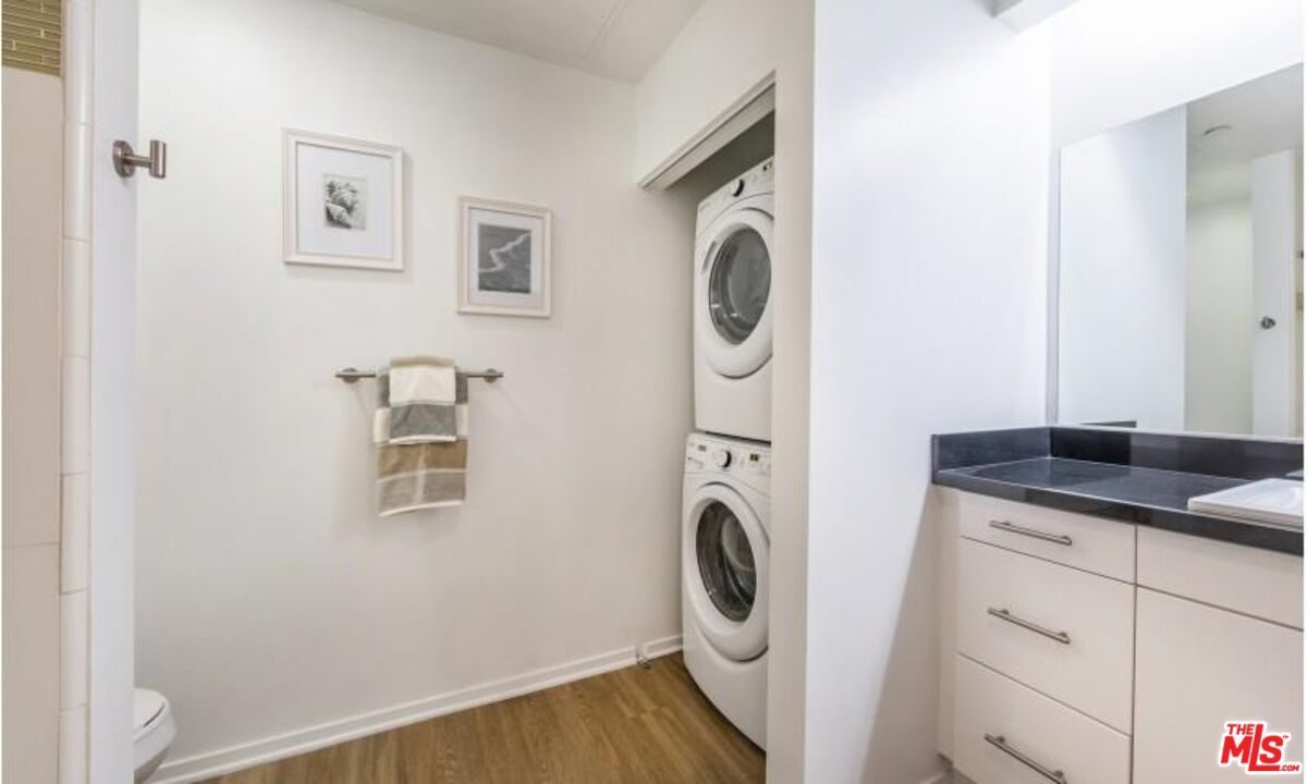 Bathroom, Interior, Tile Countertops, Utility Closets, Washer, Wood Texture Flooring