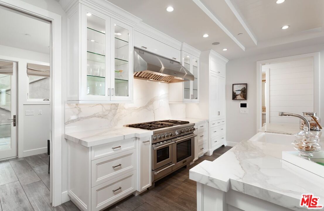 Interior, Kitchen, Marble Walls, Recessed Lighting, Stainless Steel Appliances, Wood Texture Flooring
