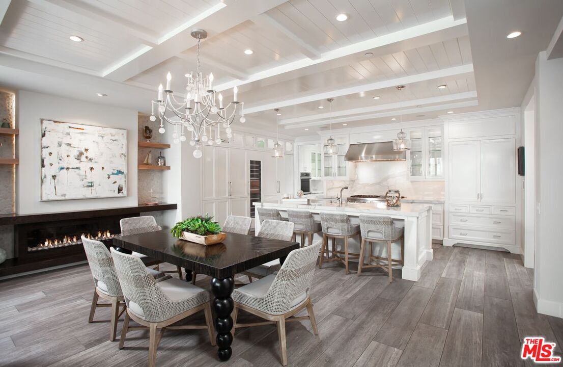 Chandelier, Dining room, Fireplace, Interior, Kitchen, Recessed Lighting, Stainless Steel Appliances, Wood Texture Flooring
