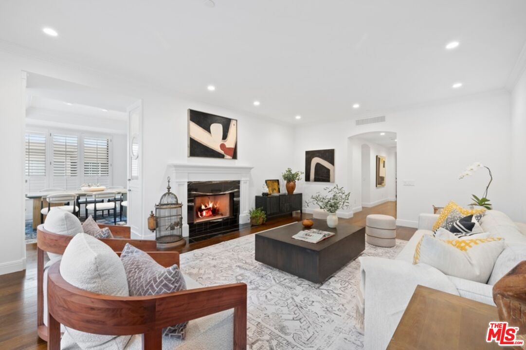 Dining room, Fireplace, Interior, Living room, Recessed Lighting, Wood Texture Flooring
