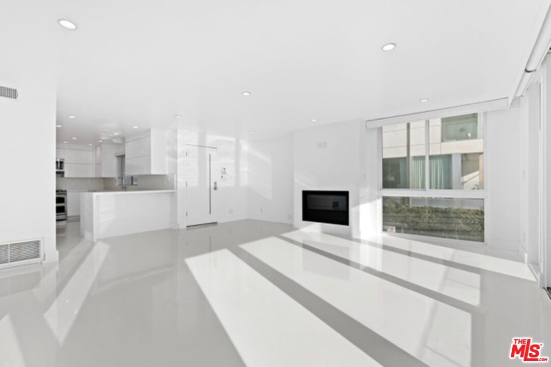 Empty room, Fireplace, Interior, Kitchen, Recessed Lighting, Stainless Steel Appliances