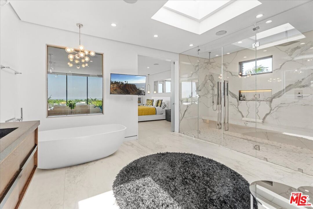 Bathroom, Free Standing Baths, Glass Shower, Interior, Marble, Marble Walls, Pendant Lights, Recessed Lighting