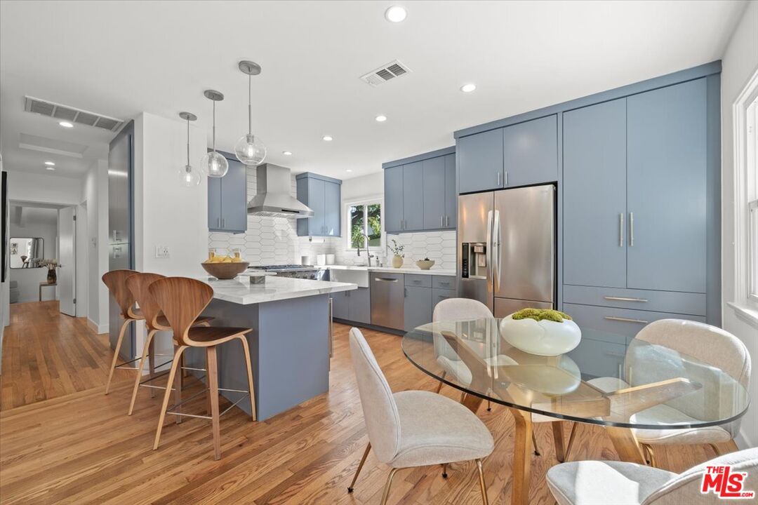 Dining room, Interior, Kitchen, Pendant Lights, Recessed Lighting, Stainless Steel Appliances, Wood Texture Flooring