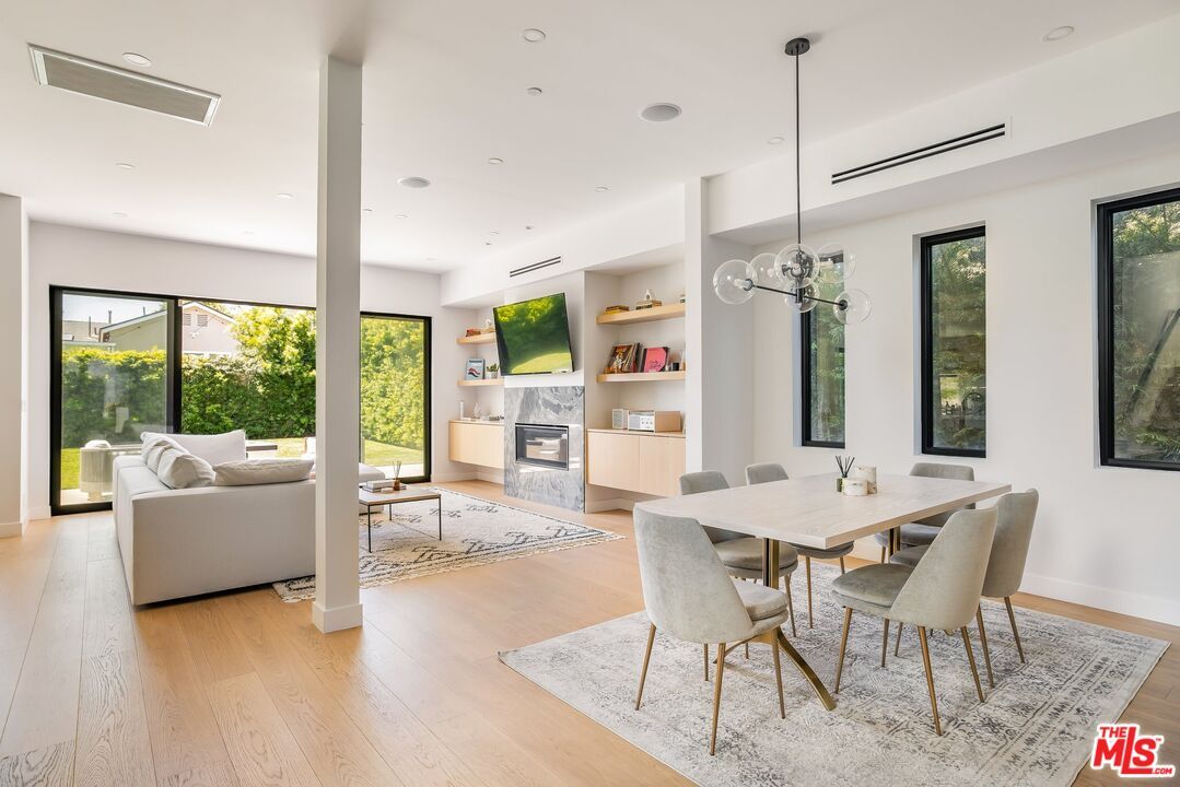 Dining room, Fireplace, Interior, Living room, Pendant Lights, Recessed Lighting, Wood Texture Flooring