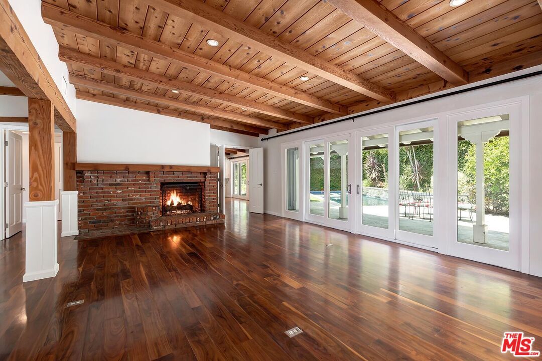 Empty room, Fireplace, Interior, Recessed Lighting, Stone Walls, Wooden Beams, Wooden Ceilings, Wood Texture Flooring