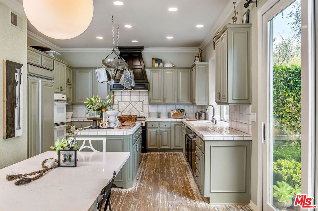 Interior, Kitchen, Pendant Lights, Recessed Lighting, Tile Countertops, Wood Texture Flooring