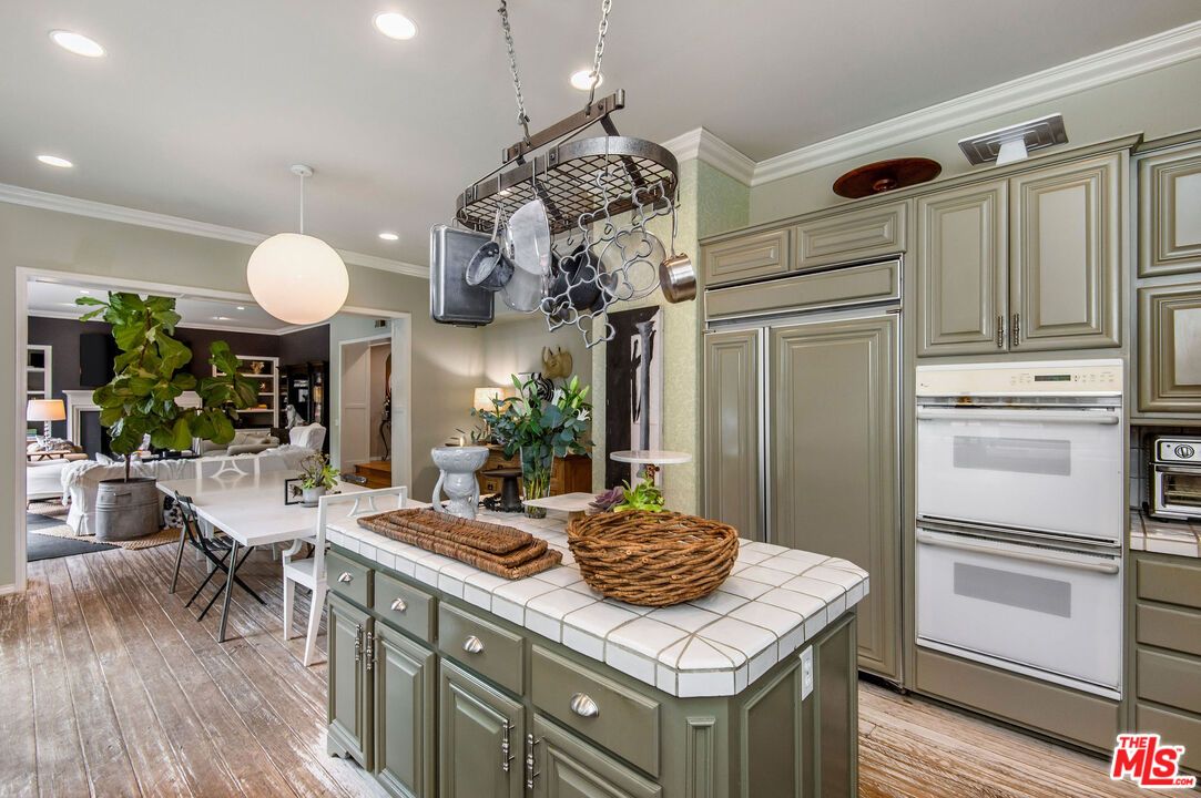 Interior, Kitchen, Living room, Pendant Lights, Recessed Lighting, Stainless Steel Appliances, Tile Countertops, Wood Texture Flooring