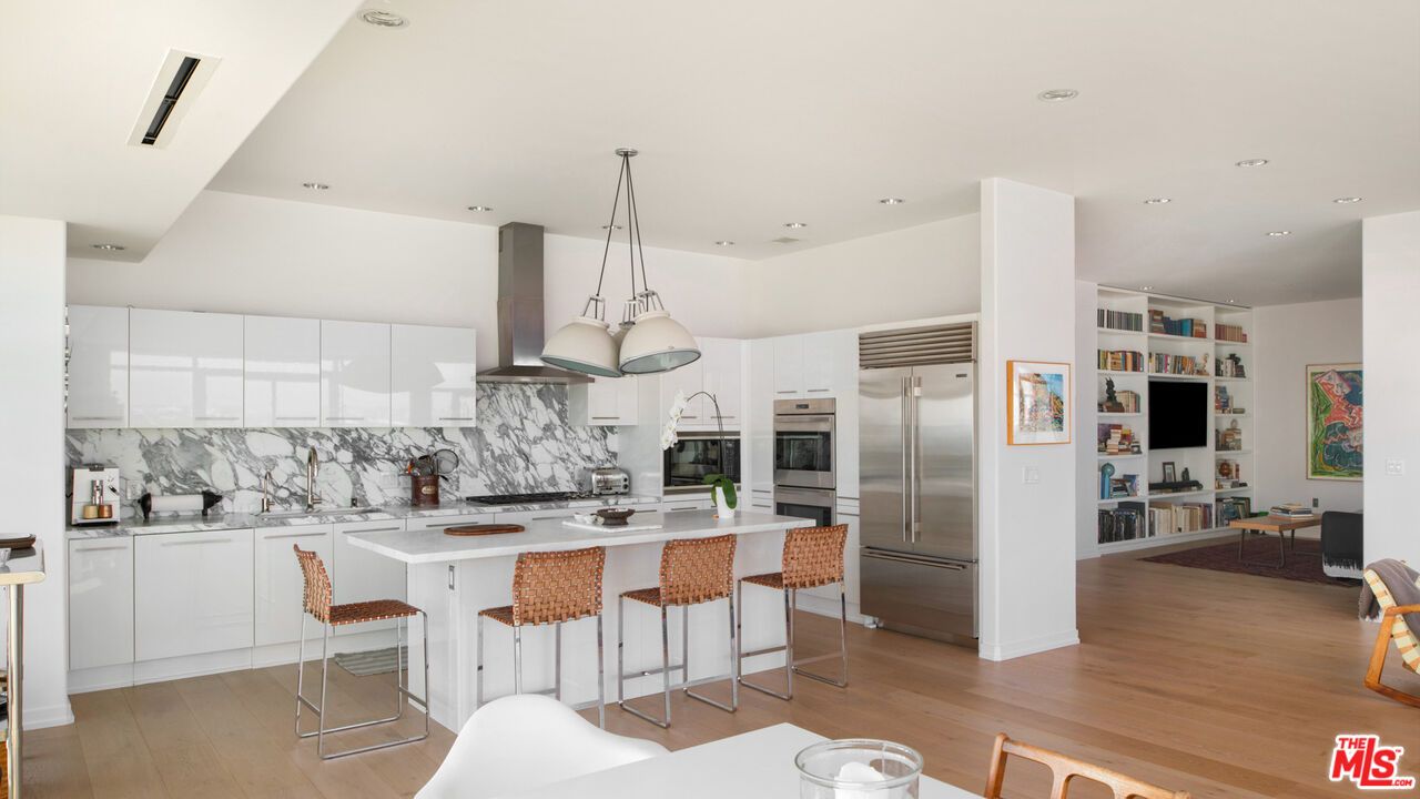 Interior, Kitchen, Marble Walls, Pendant Lights, Recessed Lighting, Stainless Steel Appliances, Wood Texture Flooring