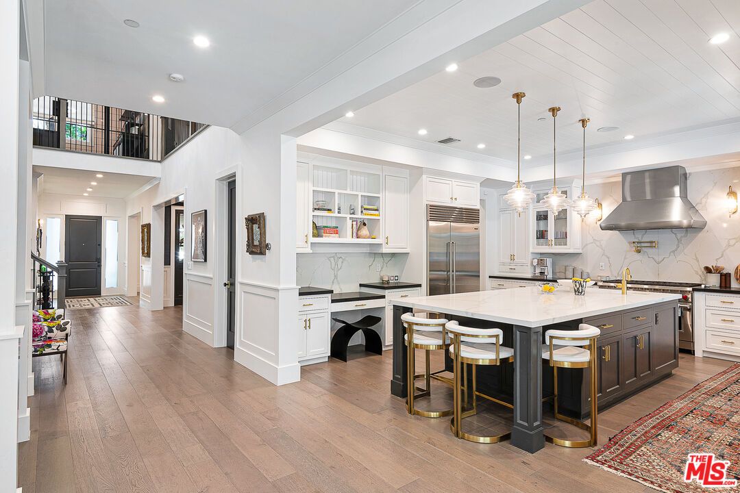 Interior, Kitchen, Marble Walls, Pendant Lights, Recessed Lighting, Stainless Steel Appliances, Wood Texture Flooring