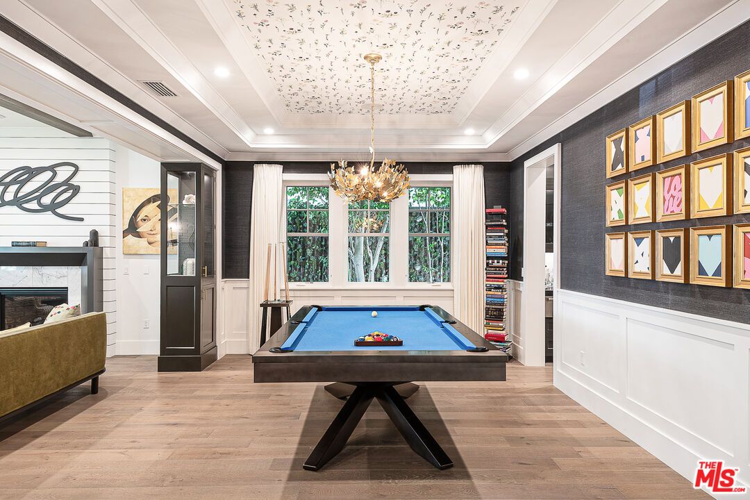Billiard Table, Chandelier, Fireplace, Game Room, Interior, Pendant Lights, Recessed Lighting, Wood Texture Flooring