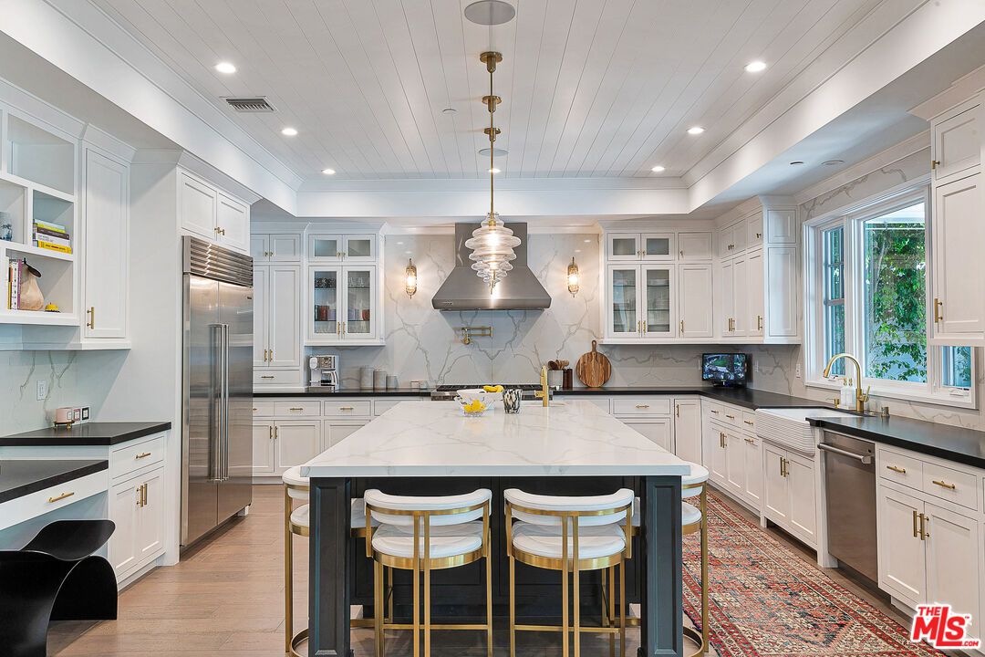 Interior, Kitchen, Marble Walls, Pendant Lights, Recessed Lighting, Stainless Steel Appliances, Wood Texture Flooring
