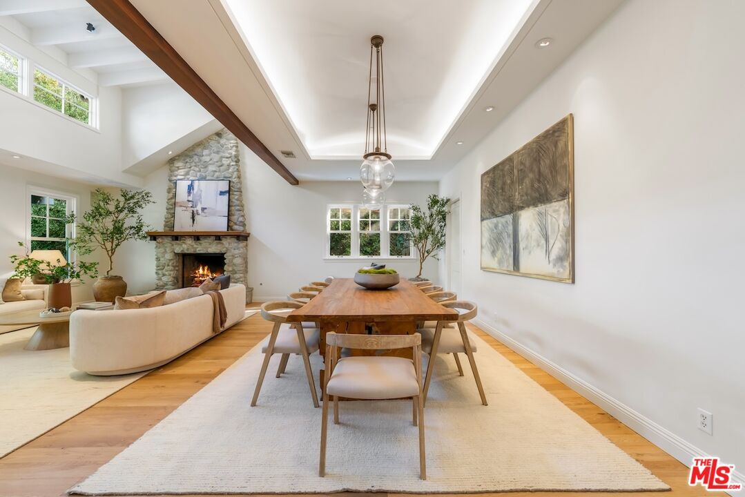 Dining room, Fireplace, Interior, Living room, Pendant Lights, Recessed Lighting, Stone Walls, Wood Texture Flooring
