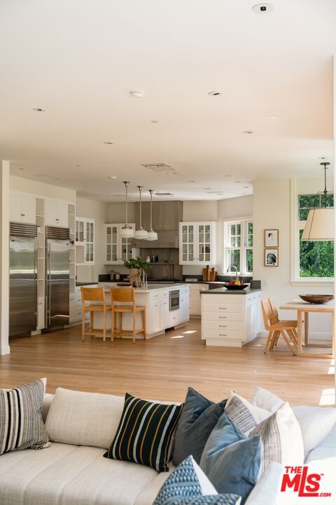 Dining room, Interior, Kitchen, Living room, Pendant Lights, Recessed Lighting, Stainless Steel Appliances, Wood Texture Flooring