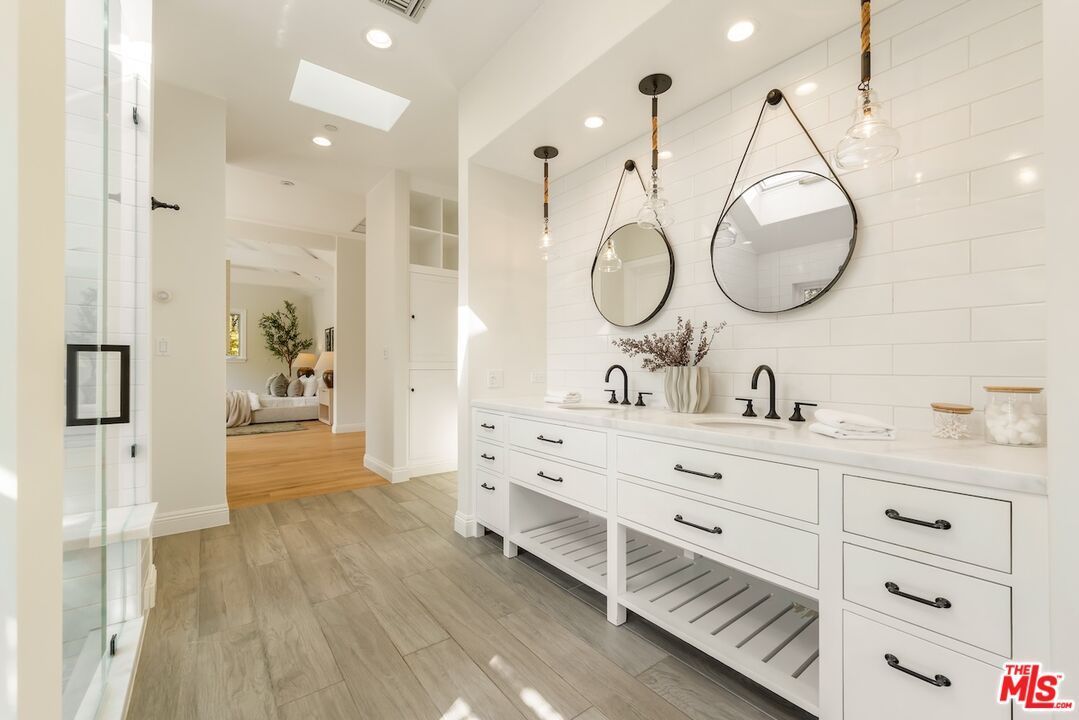 Bathroom, Dual Sink Vanities, Interior, Pendant Lights, Recessed Lighting, Wood Texture Flooring