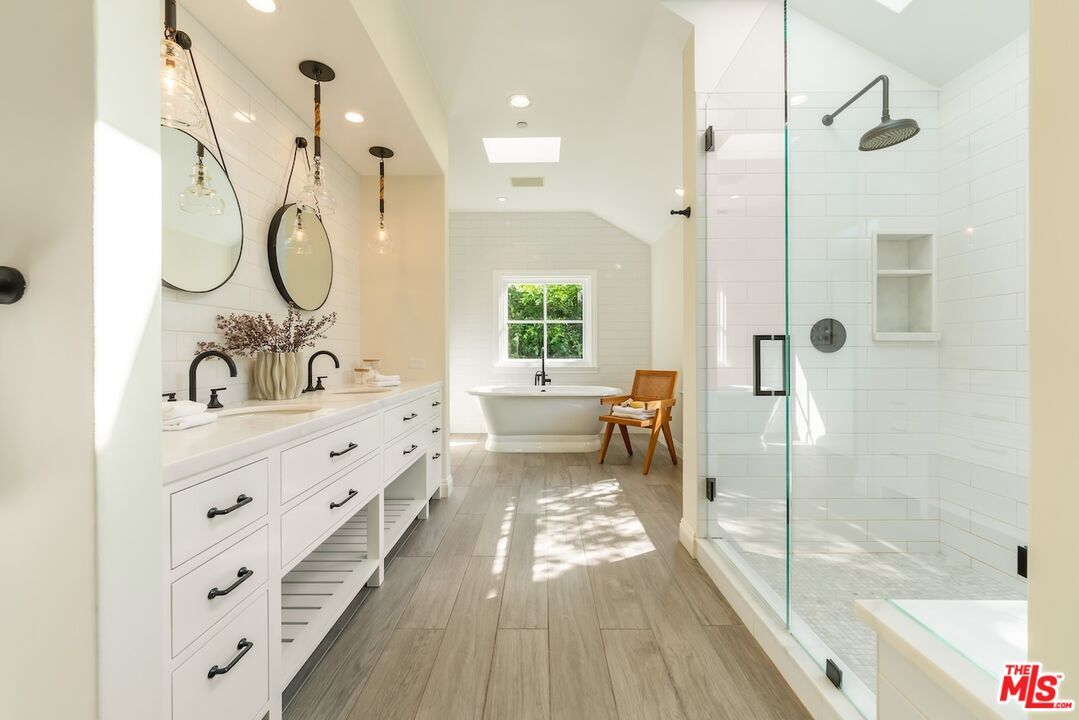 Bathroom, Dual Sink Vanities, Free Standing Baths, Glass Shower, Interior, Pendant Lights, Recessed Lighting, Wood Texture Flooring