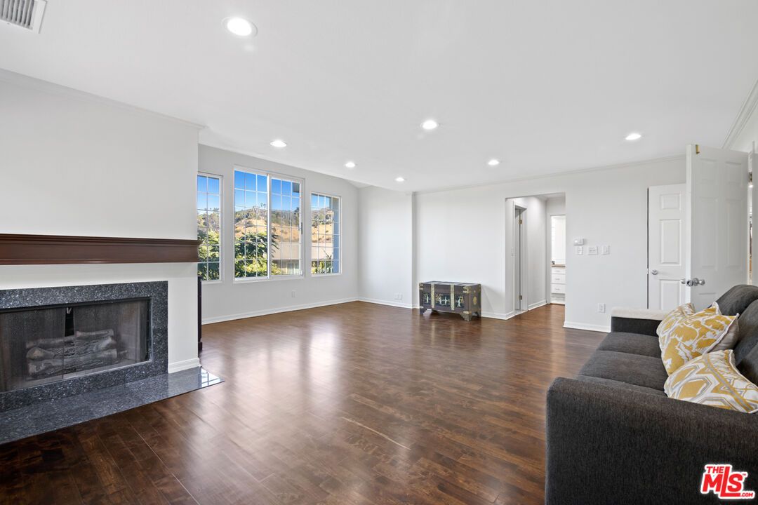 Empty room, Fireplace, Interior, Living room, Recessed Lighting, Wood Texture Flooring