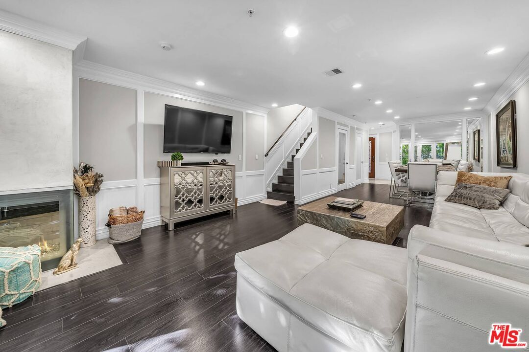 Dining room, Fireplace, Interior, Living room, Recessed Lighting, Wood Texture Flooring