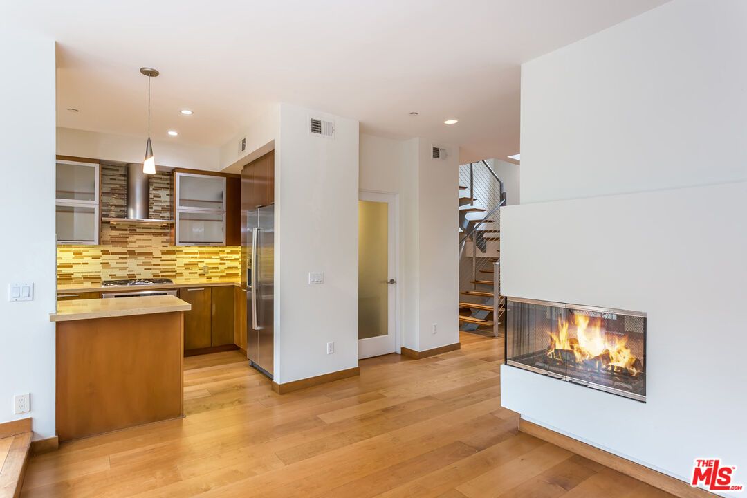 Fireplace, Interior, Kitchen, Pendant Lights, Recessed Lighting, Stainless Steel Appliances, Wood Texture Flooring