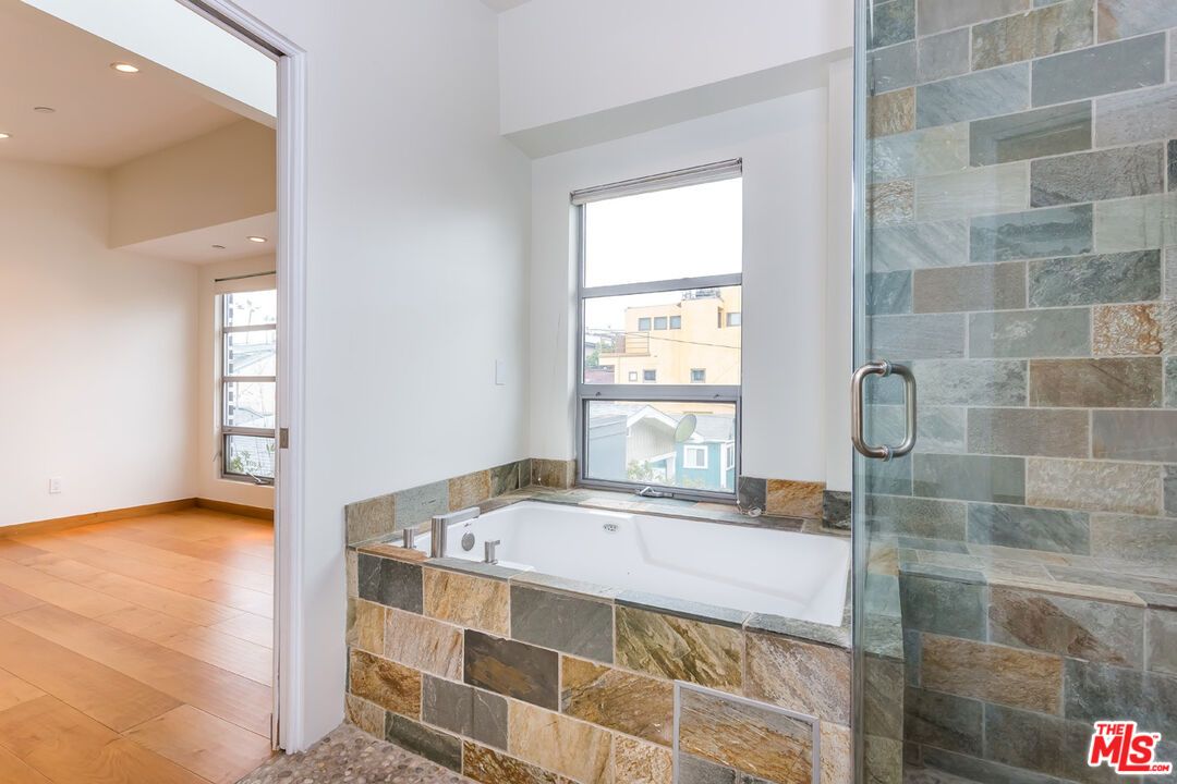 Bathroom, Glass Shower, Interior, Recessed Lighting, Stone Walls, Wood Texture Flooring