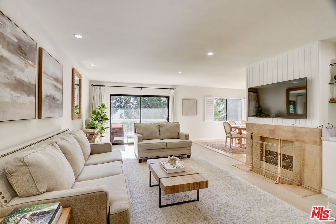 Dining room, Fireplace, Interior, Living room, Recessed Lighting, Wood Texture Flooring