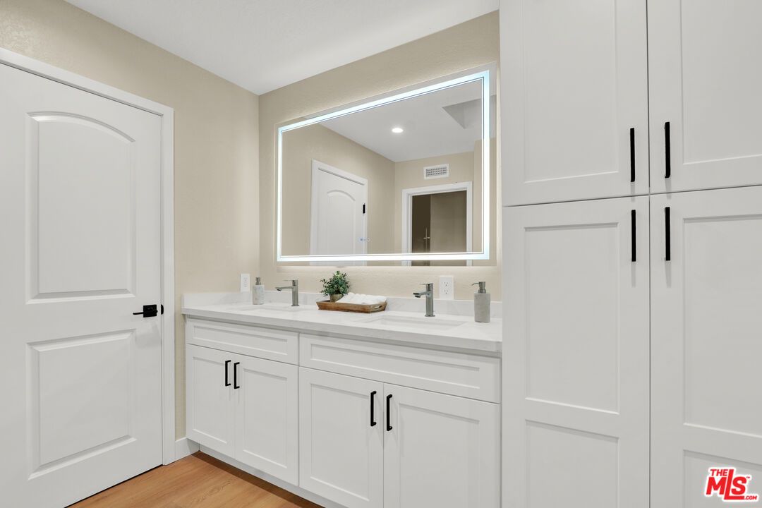 Bathroom, Dual Sink Vanities, Interior, Recessed Lighting, Wood Texture Flooring