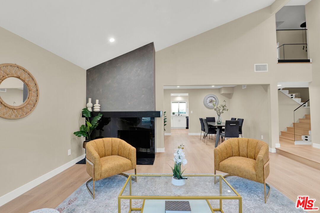 Dining room, Fireplace, Interior, Living room, Recessed Lighting, Wood Texture Flooring