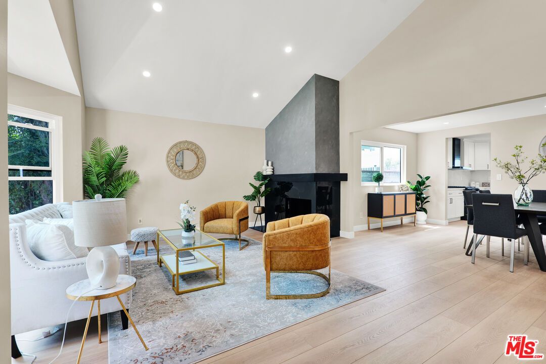 Dining room, Fireplace, Interior, Living room, Recessed Lighting, Wood Texture Flooring