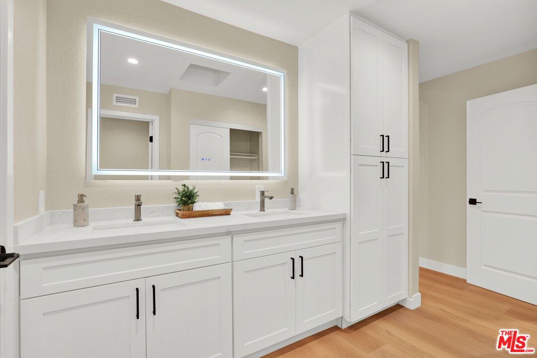 Bathroom, Dual Sink Vanities, Interior, Recessed Lighting, Wood Texture Flooring