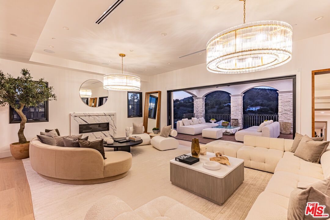 Chandelier, Fireplace, Interior, Living room, Pendant Lights, Recessed Lighting, Wood Texture Flooring