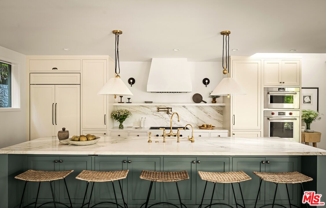 Interior, Kitchen, Marble Walls, Pendant Lights, Recessed Lighting, Stainless Steel Appliances