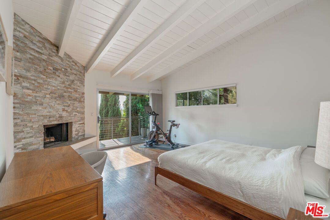 Bedroom, Fireplace, Fitness Equipment, Interior, Stone Walls, Wood Texture Flooring