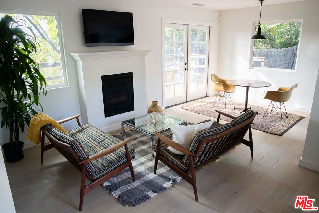 Dining room, Fireplace, Interior, Living room, Pendant Lights, Wood Texture Flooring