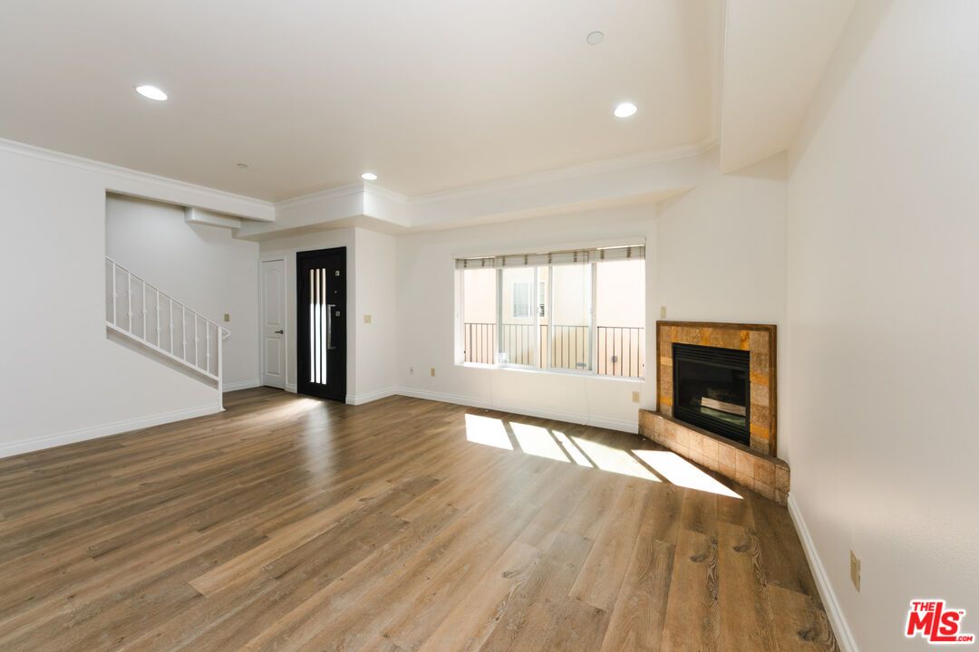 Empty room, Fireplace, Interior, Recessed Lighting, Wood Texture Flooring